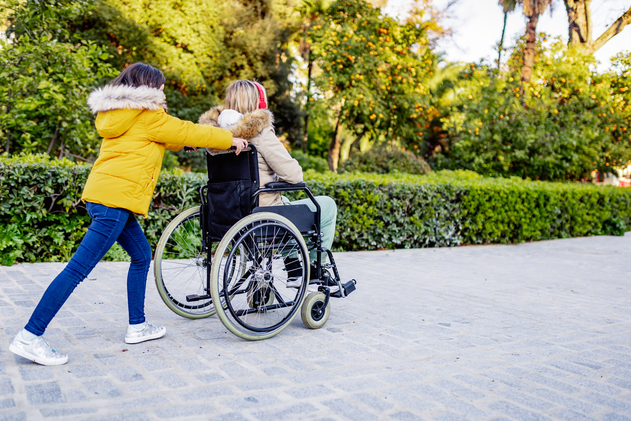 Disabled Mother with Daughter in the Park